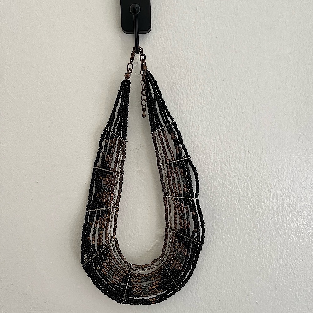 Beaded collar style necklace. Adjustable.